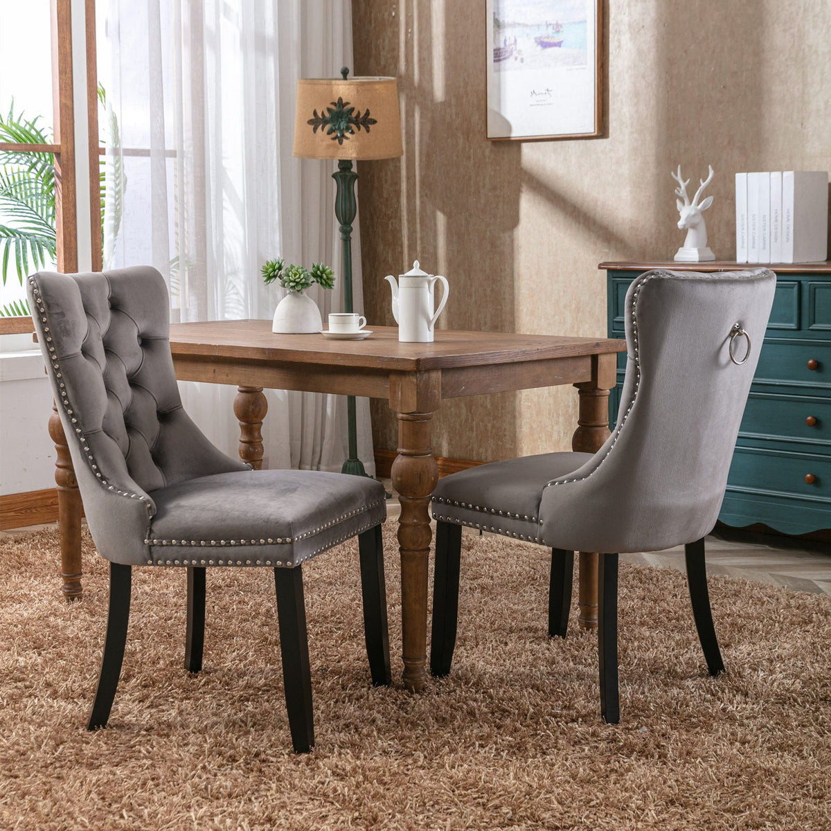 Tufted gray velvet dining chair set with nailhead trim (2 chairs) at dining table on Tampa Home & Garden Store