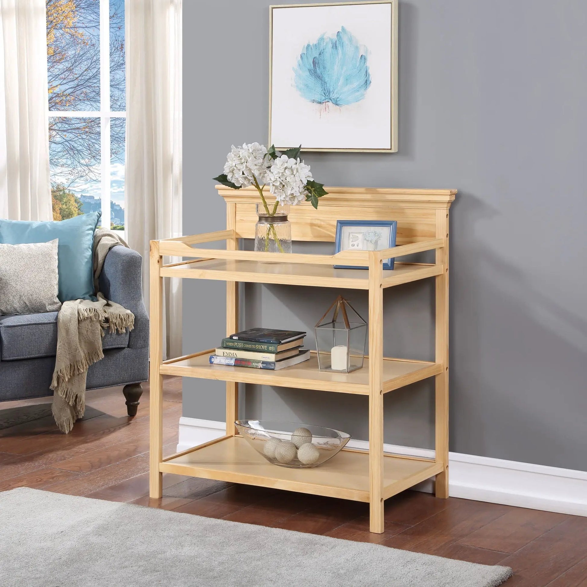 Universal Changing Table by Unique Piece Furniture, natural wood with glass top and shelf on Tampa Home & Garden Store