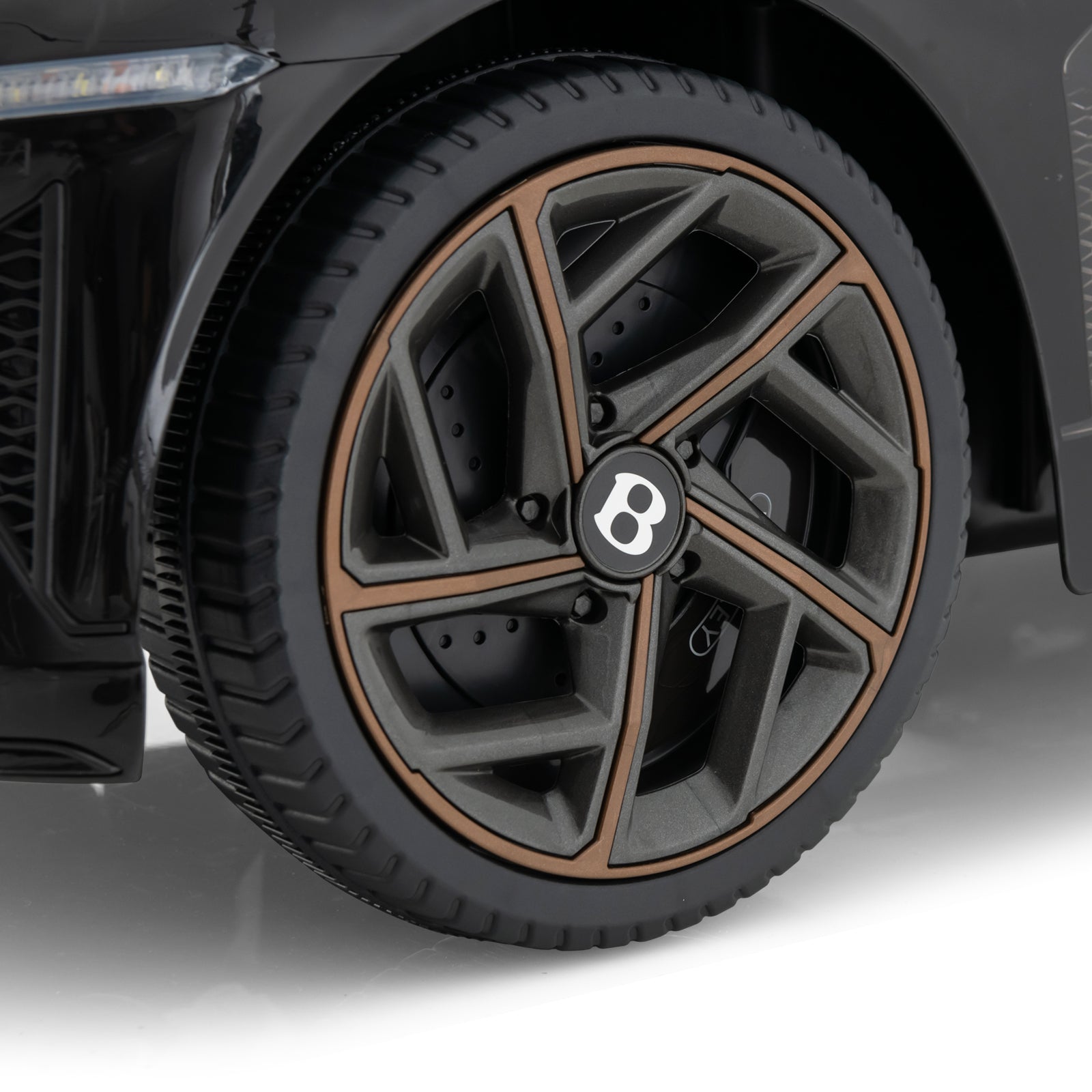 12V powered kids ride-on Bentley Bacalar wheel with black alloy rim and bronze lip on Tampa Home & Garden Store