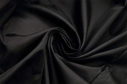 Black satin-like fabric swatch from Stevvex on Tampa Home & Garden Store