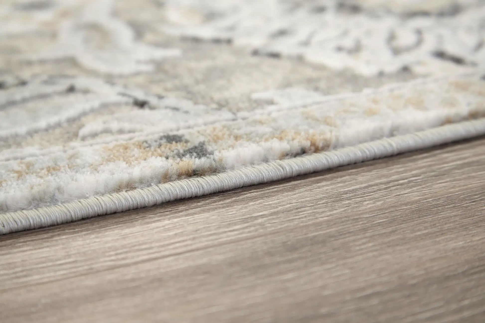 Kilkenny rug, beige-gray area rug with subtle pattern and plush pile, edge binding on Tampa Home & Garden Store