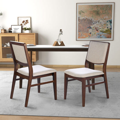 Beige linen dining chair set of 2 with padded seats and dark wood legs around a dining table on Tampa Home & Garden Store