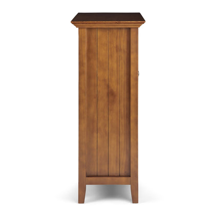 Acadian medium storage cabinet handcrafted in warm wood with vertical panel doors on Tampa Home & Garden Store