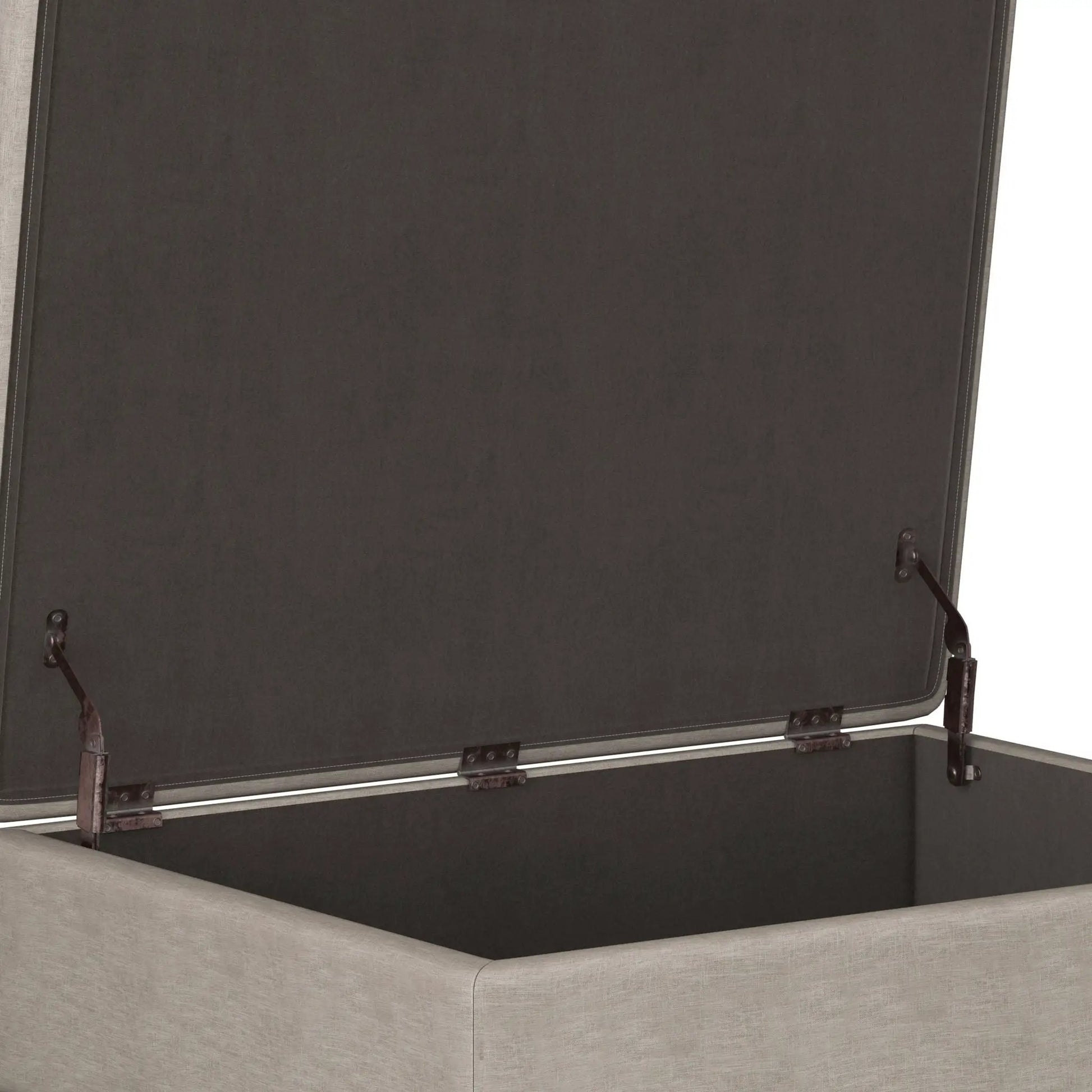 Owen upholstered rectangular storage ottoman in dark charcoal fabric with metal hardware on Tampa Home & Garden Store
