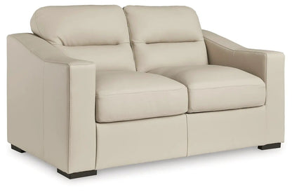Treasure Trove 2-Pc sofa loveseat almond leather-like upholstery, plush cushions, feet on Tampa Home & Garden Store