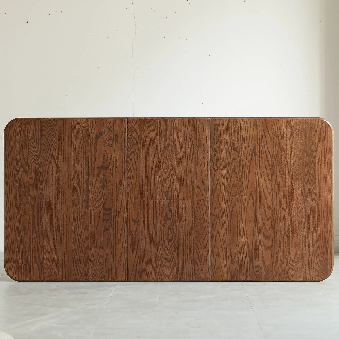 Wood veneer dining sideboard with rounded corners and vertical grain against a pale wall on Tampa Home & Garden Store