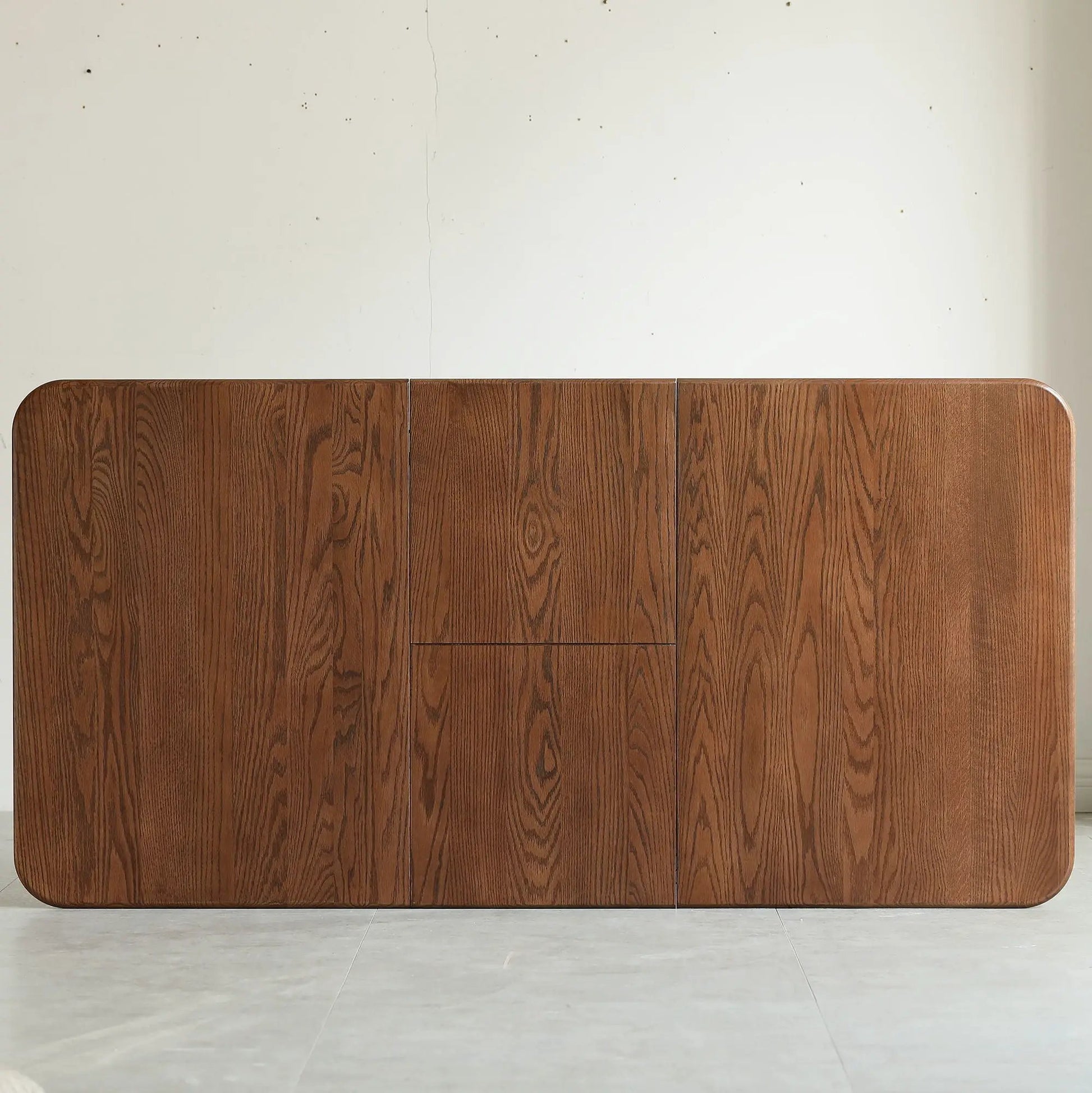 Wood veneer dining sideboard with rounded corners and vertical grain against a pale wall on Tampa Home & Garden Store