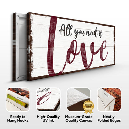 All You Need Is Love canvas sign with white distressed wood background and maroon lettering on Tampa Home & Garden Store
