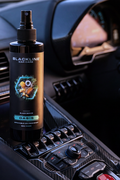 Blackline Car Care 8oz Oasis black car air freshener spray bottle on car dash interior on Tampa Home & Garden Store