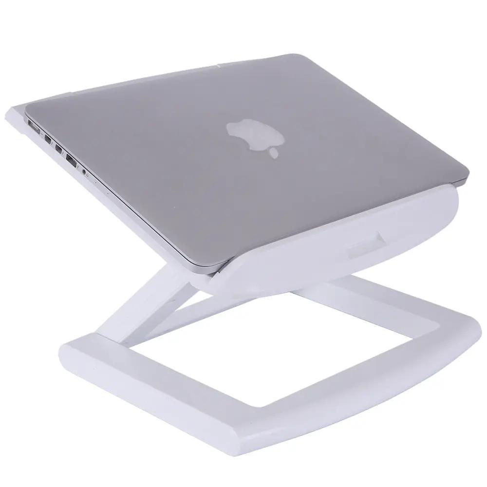 Portable notebook computer stand by FLIPSTYLEZLLC, white foldable desk stand supporting a silver Apple laptop on Tampa Home & Garden Store