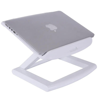 Portable notebook computer stand by FLIPSTYLEZLLC, white foldable desk stand supporting a silver Apple laptop on Tampa Home & Garden Store