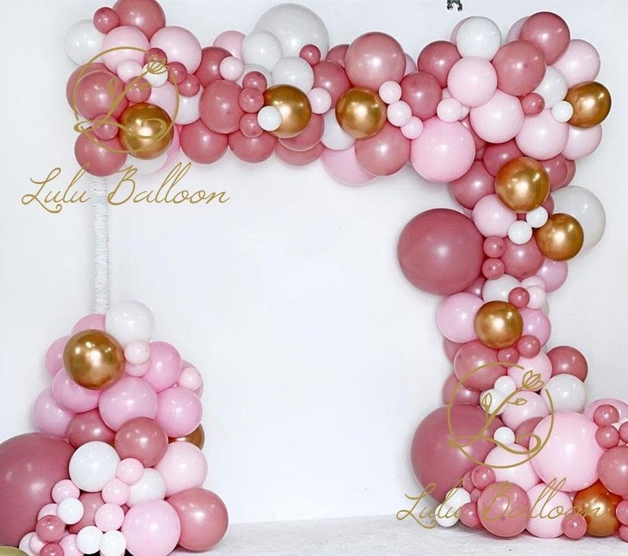 135 pcs Rosewood Blush Pink And Gold Balloons forming a decorative garden party arch on Tampa Home & Garden Store