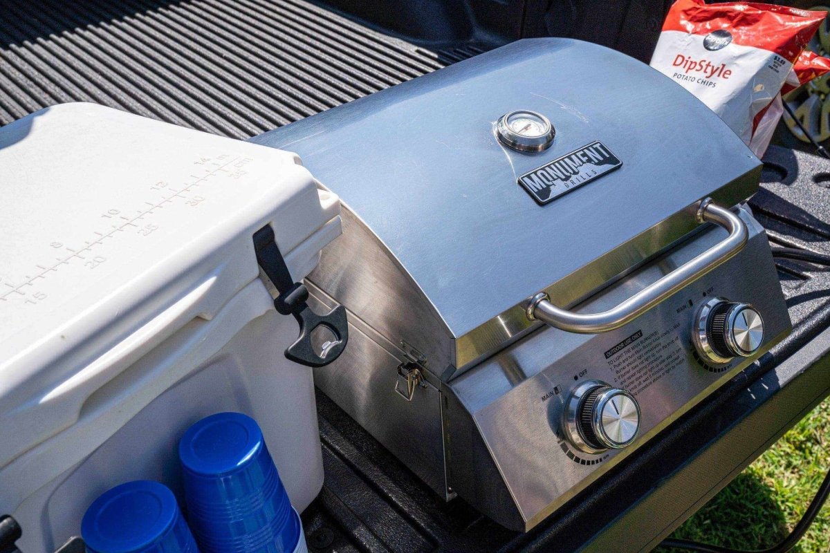 Monument Grills stainless tabletop propane grill with dual knobs and front handle on Tampa Home & Garden Store