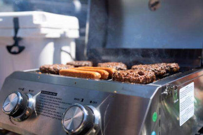 Tabletop propane grill by Monument Grills, stainless steel, cooking burgers and hot dogs on Tampa Home & Garden Store