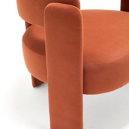 Velvet accent chair orange close-up with curved armrests on Tampa Home & Garden Store