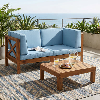 Brava X-Back 2-Seater sectional loveseat with coffee table, blue cushions, wooden frame outdoor patio set on Tampa Home & Garden Store