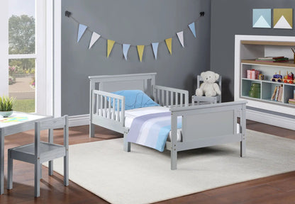 Connelly reversible panel toddler beds in gray wood with blue bedding, 2 shown on Tampa Home & Garden Store