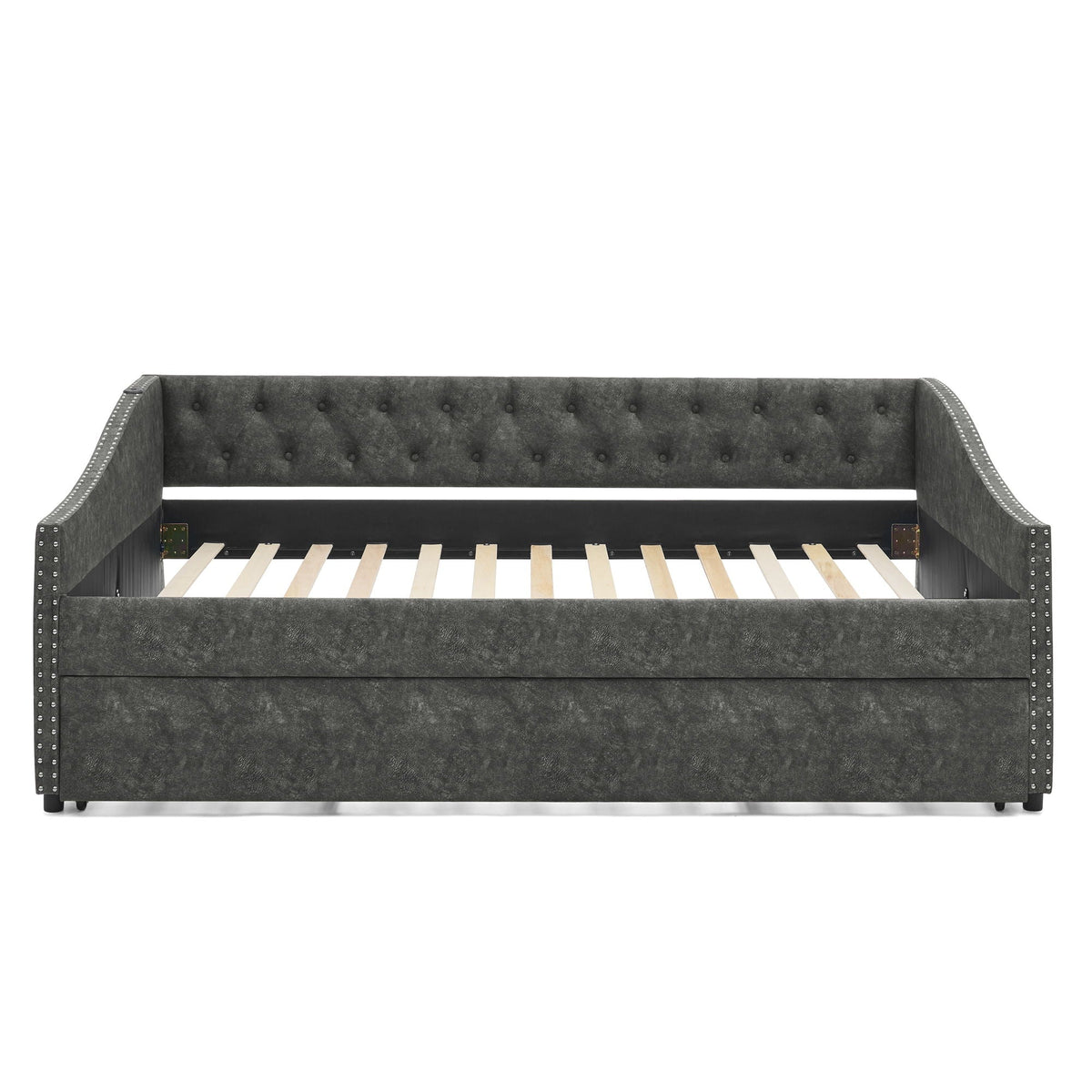 Upholstered daybed with pull-out trundle in dark gray fabric, tufted back and nailhead trim on Tampa Home & Garden Store