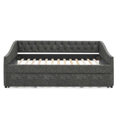 Upholstered daybed with pull-out trundle in dark gray fabric, tufted back and nailhead trim on Tampa Home & Garden Store