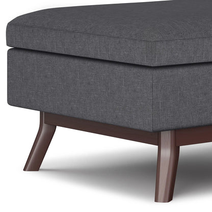 Owen Upholstered Rectangular Storage Ottoman in dark gray fabric with wooden legs on Tampa Home & Garden Store