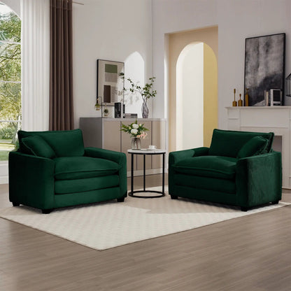 Pair of modern classic fabric arm chairs in deep green with plush pillows in living room on Tampa Home & Garden Store