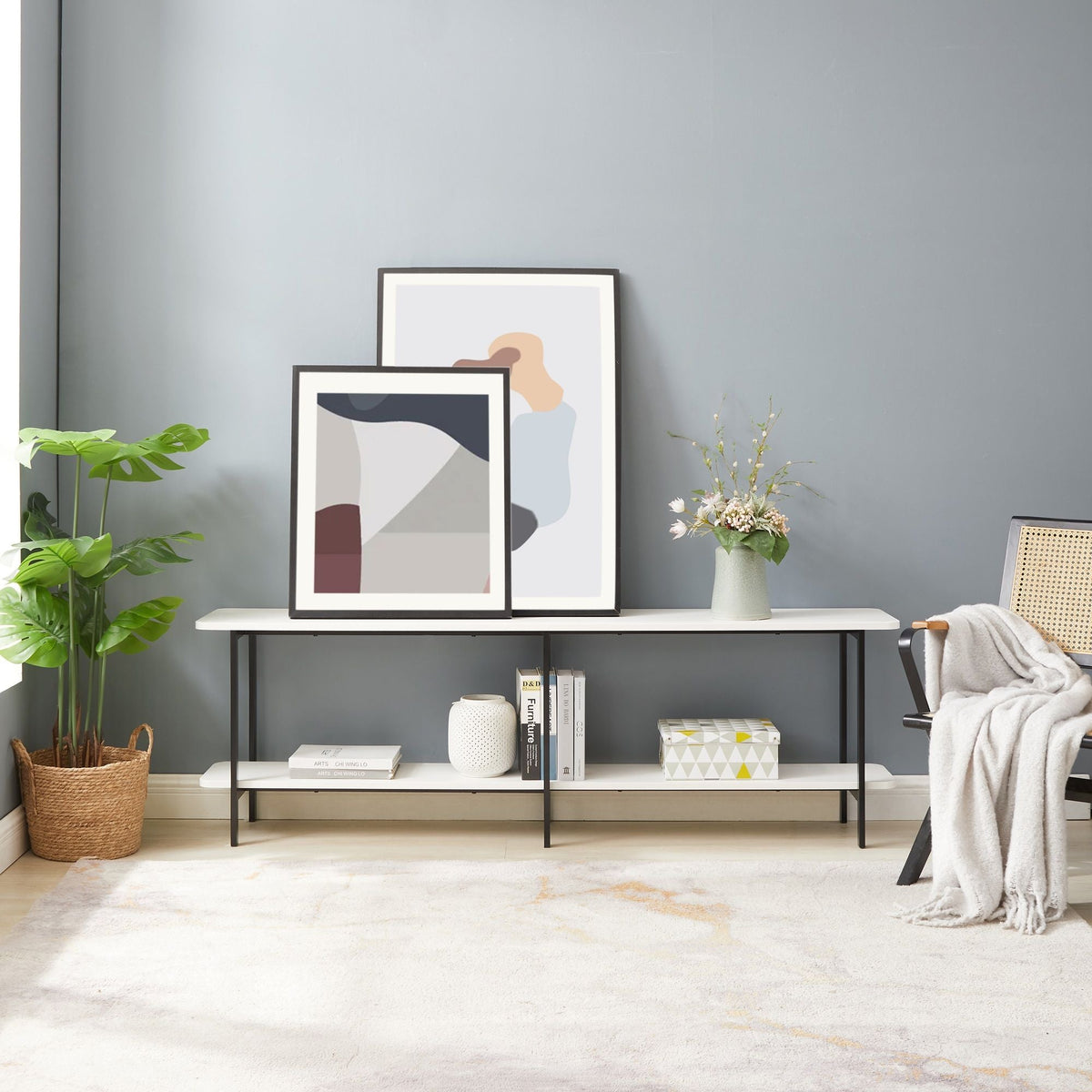 Celine 2-shelf console table with white shelves and black frame on a gray wall with framed art on Tampa Home & Garden Store