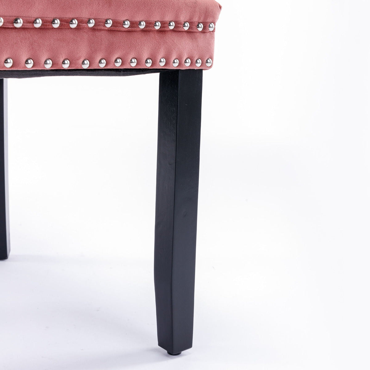 Tufted dining chair set in pink velvet with nailhead trim and black legs on Tampa Home & Garden Store