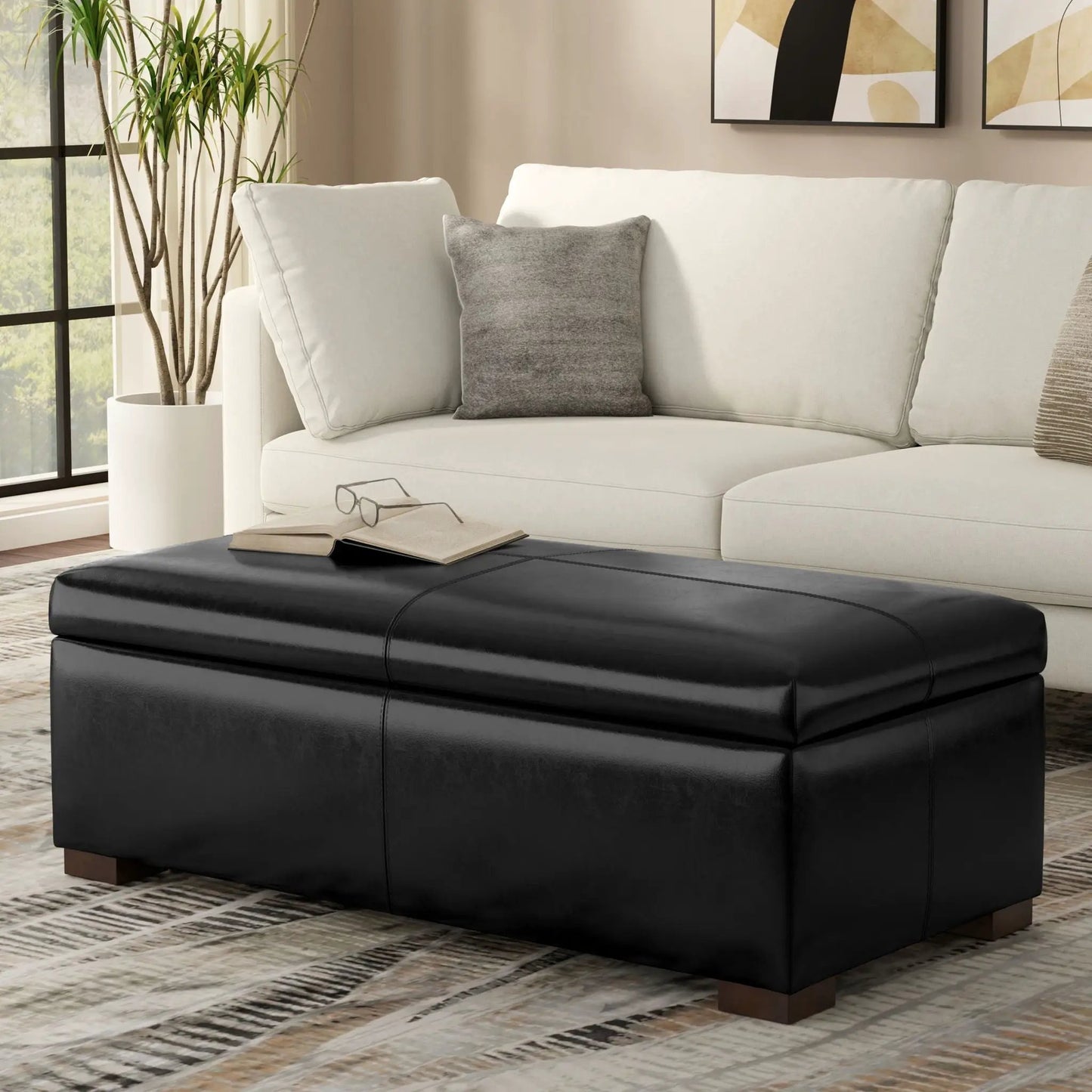 Gabbie coffee table upholstered storage ottoman in black leather with cushioned top on Tampa Home & Garden Store