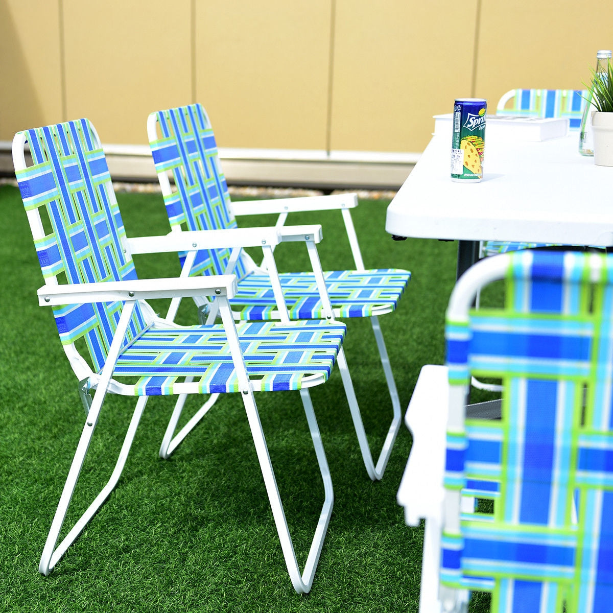 GemGear 6-piece folding beach chair set with blue-green striped webbing and white frames on grass on Tampa Home & Garden Store