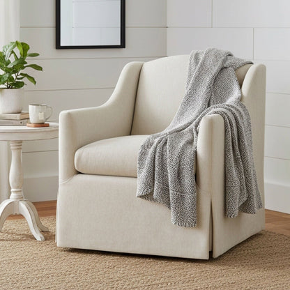 Skirted swivel accent chair in beige fabric with 360° swivel base on Tampa Home & Garden Store