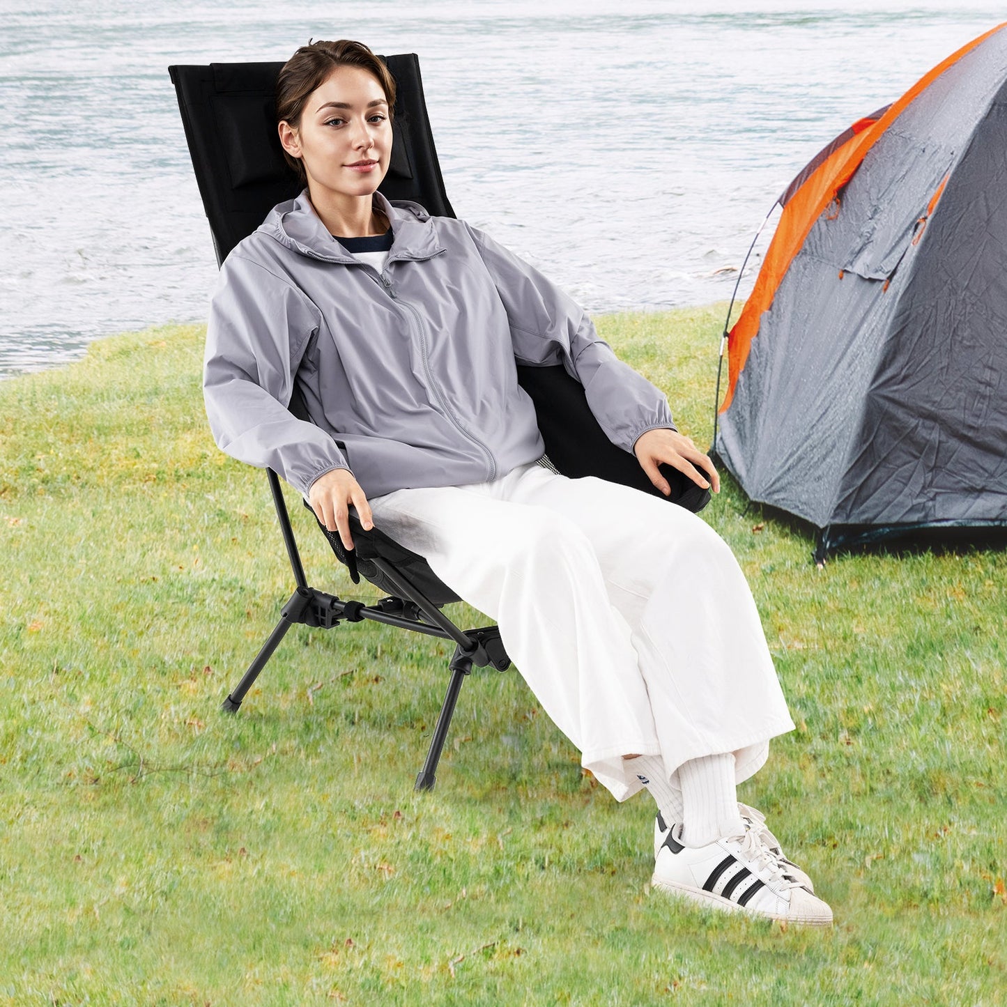 GemGear high-back camping chair in black with pillow and carry bag outdoors by tent and lake on Tampa Home & Garden Store