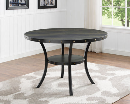 Biony espresso wood round dining table with nailhead trim and black metal legs in bright room on Tampa Home & Garden Store