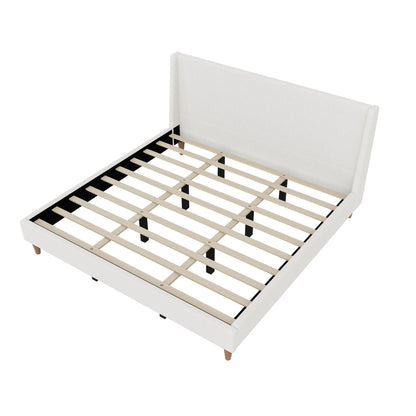Upholstered platform bed with wingback white headboard from HouseOfZazla slats on black frame on Tampa Home & Garden Store