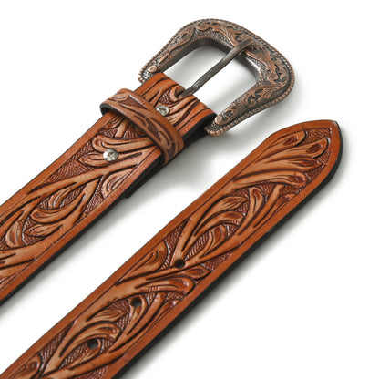 Two brown Western cowboy leather belts with intricate floral tooling and ornate buckles on Tampa Home & Garden Store
