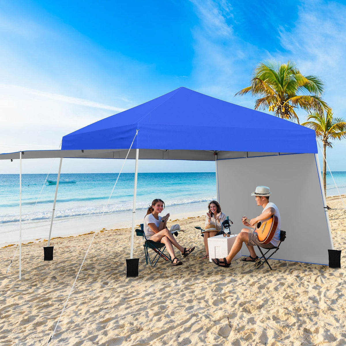 GemGear 14 x 9.2 ft pop up canopy tent with blue top and 2 convertible sidewalls on a beach on Tampa Home & Garden Store