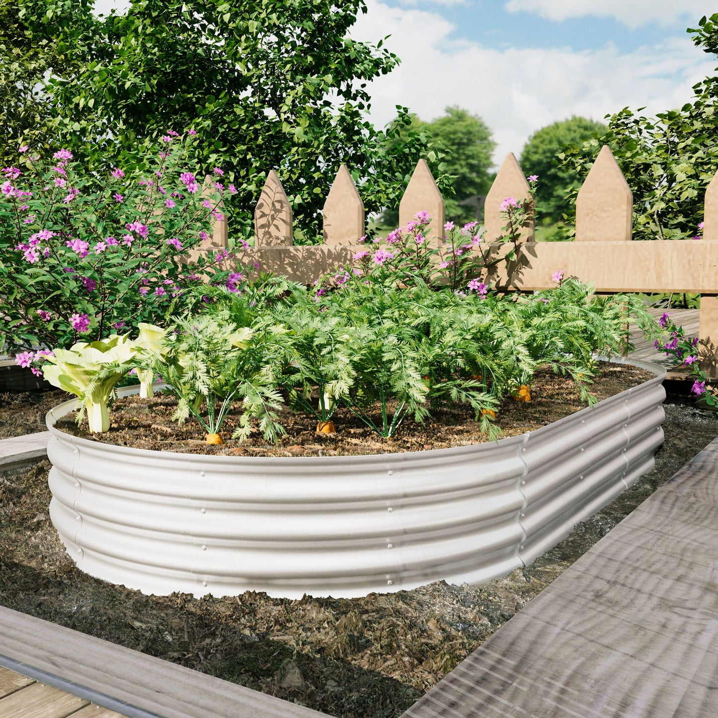 Heavy Duty Galvanized Raised Garden Bed Kit with curved panels in a garden with pink blooms on Tampa Home & Garden Store