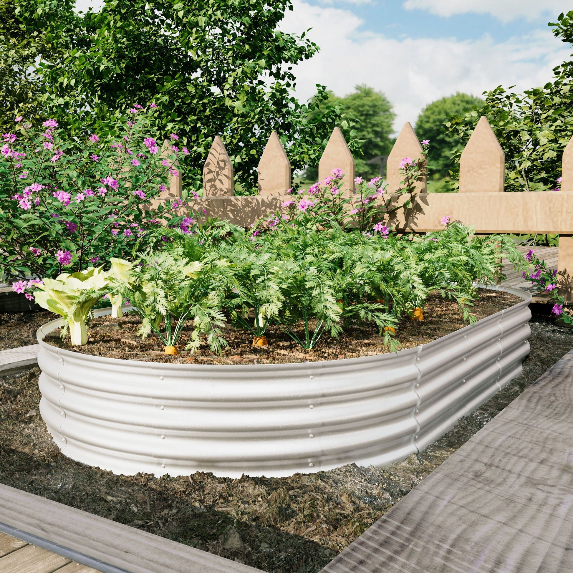 Heavy Duty Galvanized Raised Garden Bed Kit with curved panels in a garden with pink blooms on Tampa Home & Garden Store