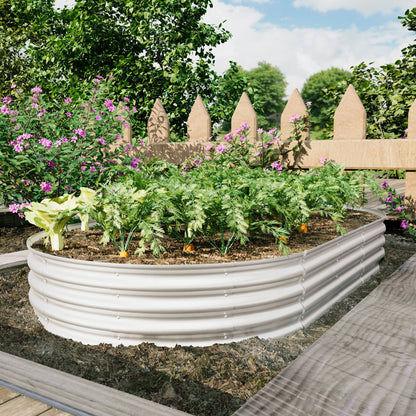 Heavy Duty Galvanized Raised Garden Bed Kit with curved panels in a garden with pink blooms on Tampa Home & Garden Store