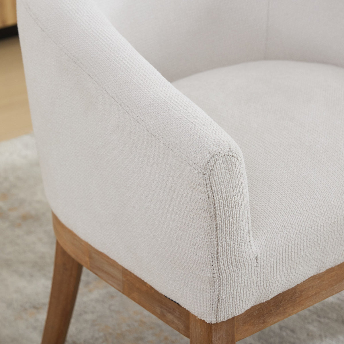 Mid Century Modern upholstered barrel dining chair with arms in light beige fabric, wooden legs on Tampa Home & Garden Store