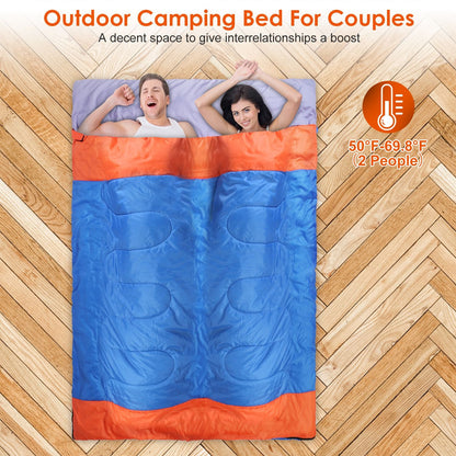 3-Person sleeping bag in blue and orange; two people inside on wood floor with sack on Tampa Home & Garden Store