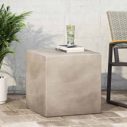 Outdoor Indoor Square Lightweight Side Table, beige concrete look, with books and a glass on Tampa Home & Garden Store