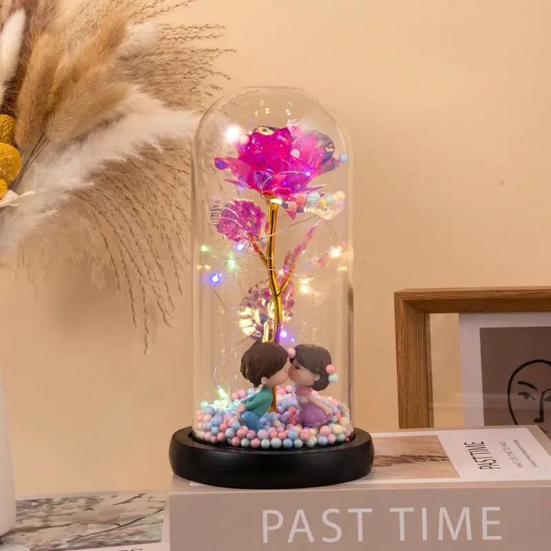 Eternal Rose LED light in glass dome by FLIPSTYLEZLLC with pink petals and lights on base on Tampa Home & Garden Store