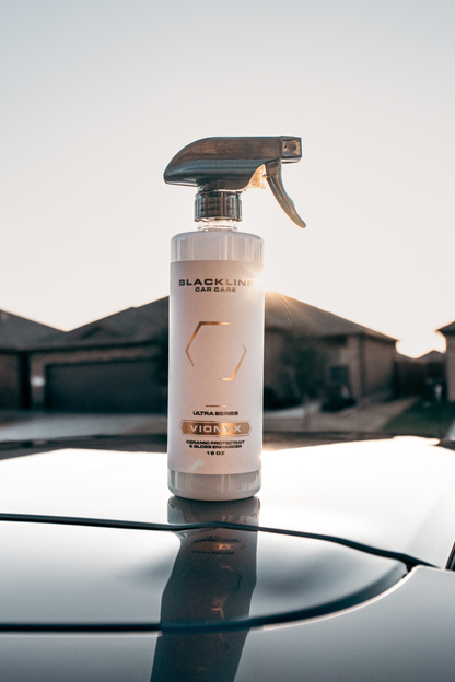Blackline VIONYX Ceramic Protectant spray bottle, white bottle with logo, car hood backdrop on Tampa Home & Garden Store
