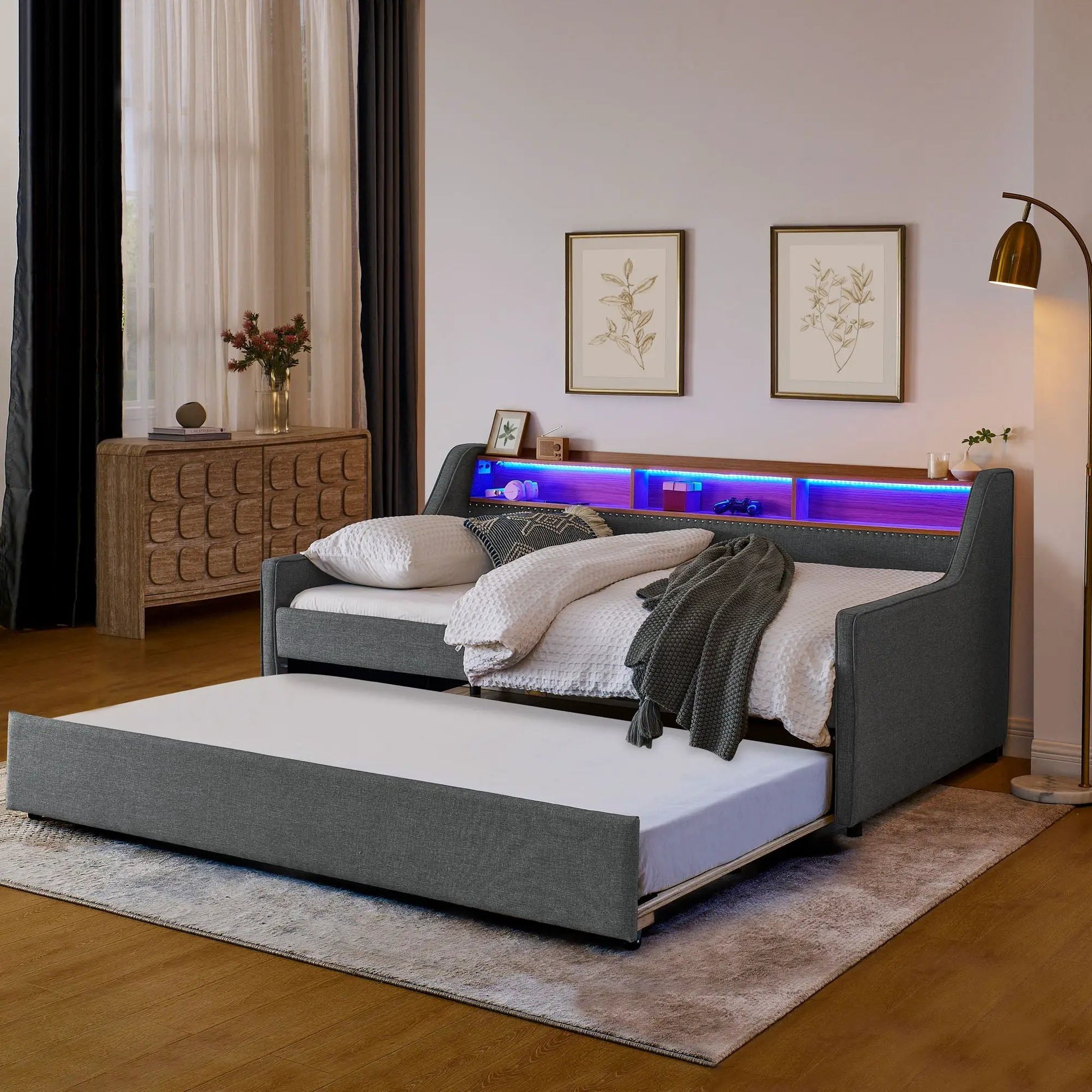 Upholstered gray sofa bed with built-in storage headboard and blue LED shelf lighting on Tampa Home & Garden Store