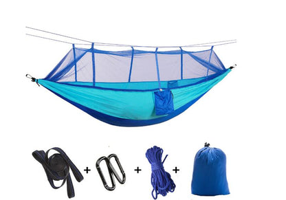 Double parachute hammock with mosquito net in blue; includes straps, carabiners, rope bag on Tampa Home & Garden Store