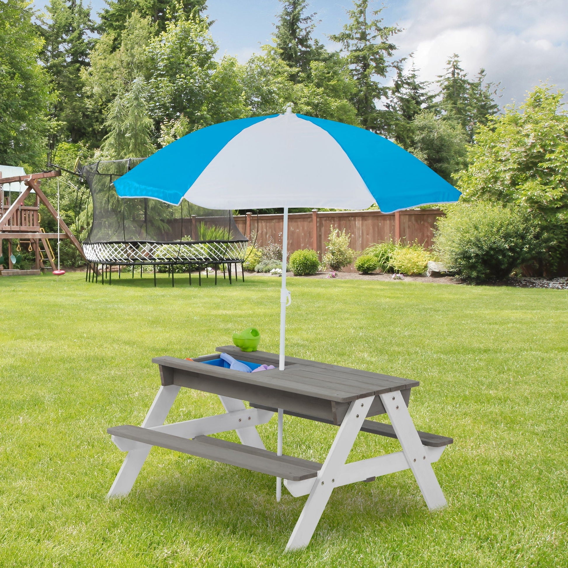 3-In-1 Kids Outdoor Wooden Picnic Table With Umbrella by HouseOfZazla, gray wood with blue/white canopy in yard on Tampa Home & Garden Store