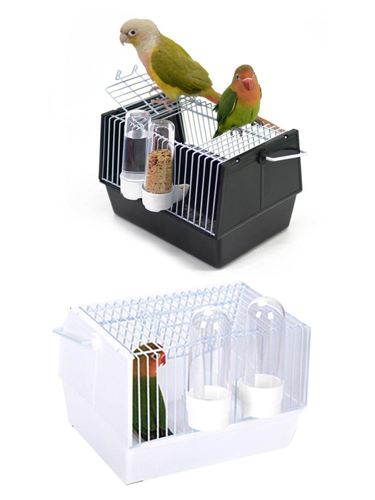 Bird cage set: black cage with feeders and parrots; white plastic cage with dome feeders on Tampa Home & Garden Store