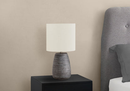 Contemporary ceramic table lamp gray and cream with textured base HouseOfZazla on nightstand on Tampa Home & Garden Store