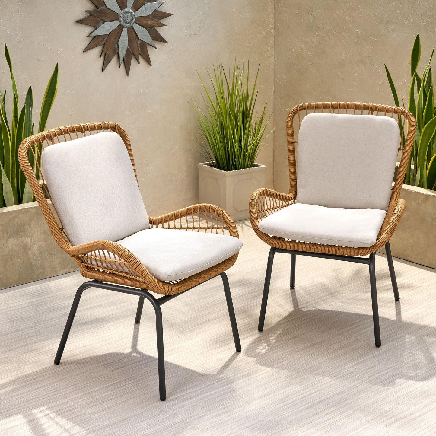 Outdoor wicker club chairs set of 2 with light beige cushions and black metal legs on Tampa Home & Garden Store