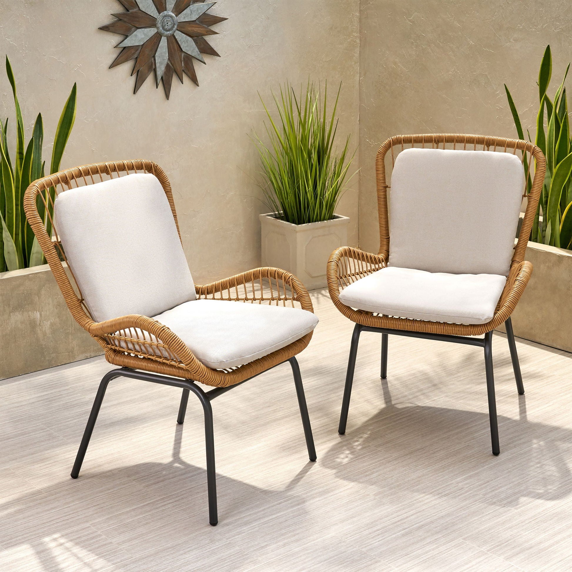 Outdoor wicker club chairs set of 2 with light beige cushions and black metal legs on Tampa Home & Garden Store